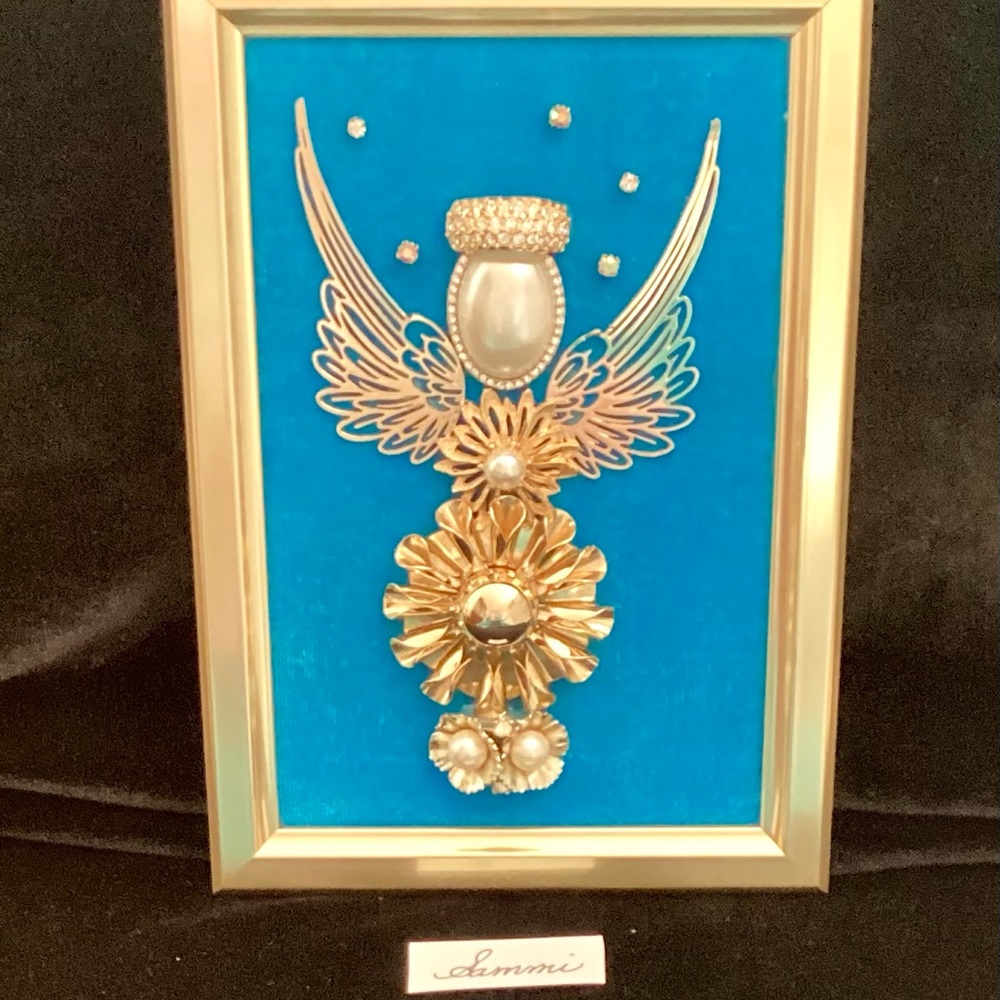 Vintage jewelry recycled, to create this one of a kind angel